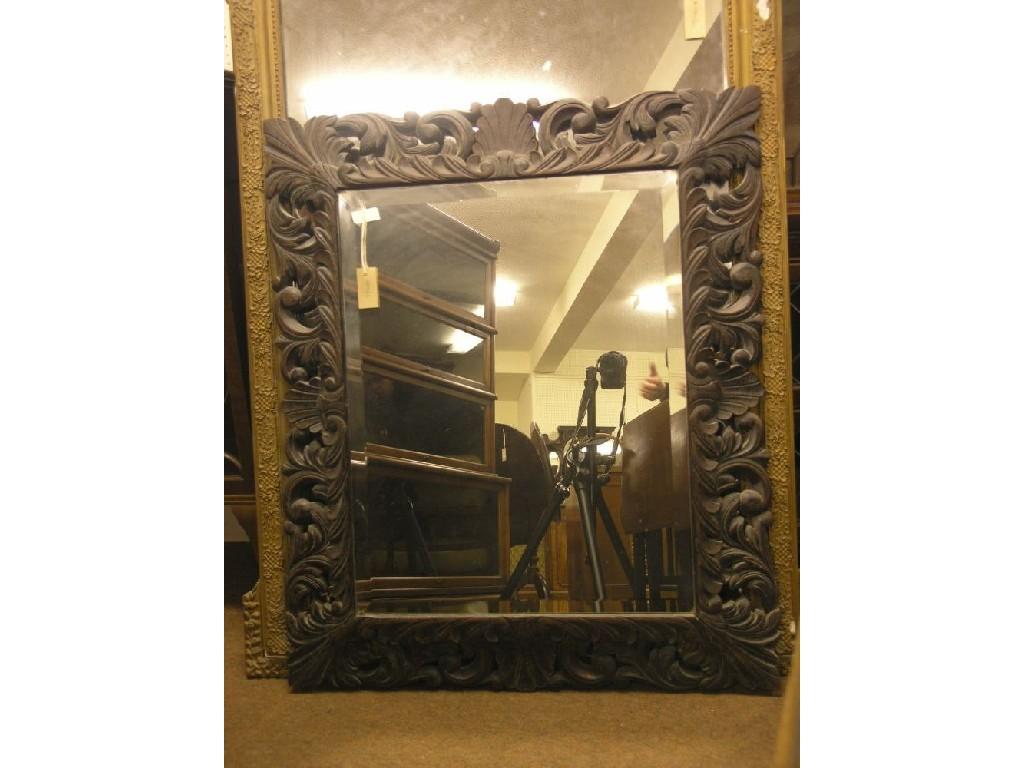 Appraisal: A Victorian dark oak wall mirror rectangular-shape with bevelled plate