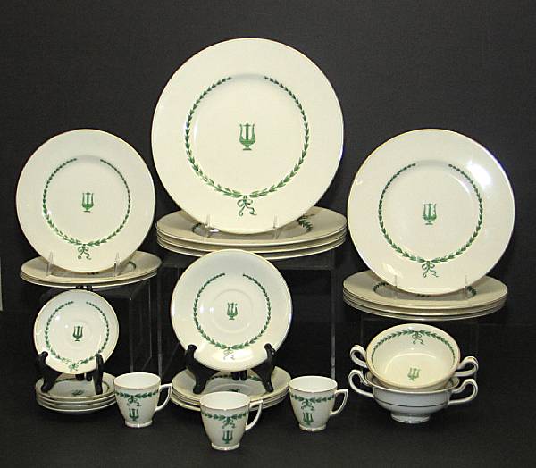 Appraisal: A Minton porcelain dinner service circa Centering a lyre within