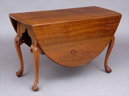 Appraisal: PENNSYLVANIA CHIPPENDALE WALNUT DROP LEAF TABLE The top with bowed