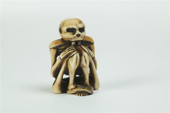 Appraisal: IVORY CARVING Japan early th century Seated skeleton ''h Ivory