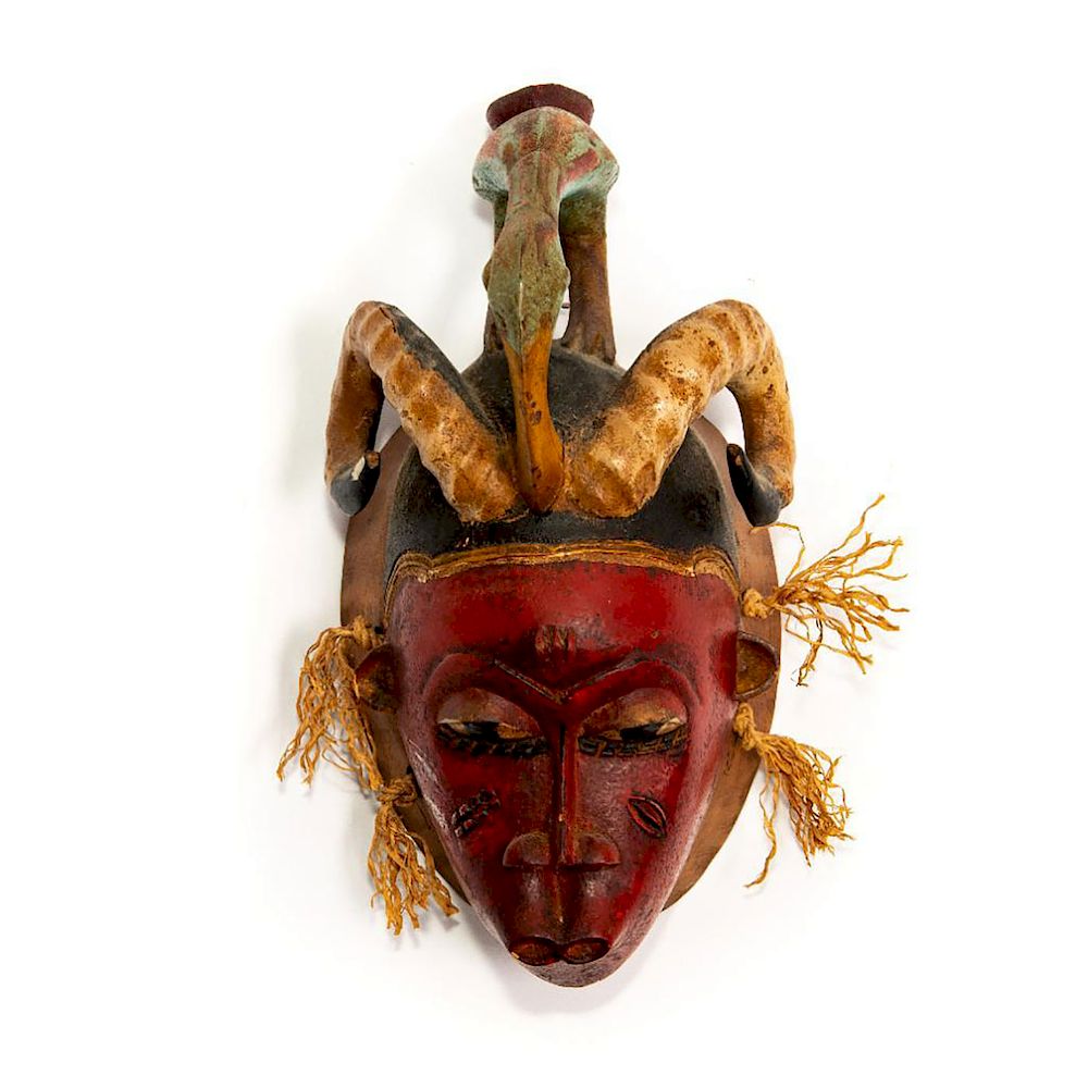 Appraisal: VINTAGE AFRICAN DECORATED WOODEN WALL MASK Horned mask with long