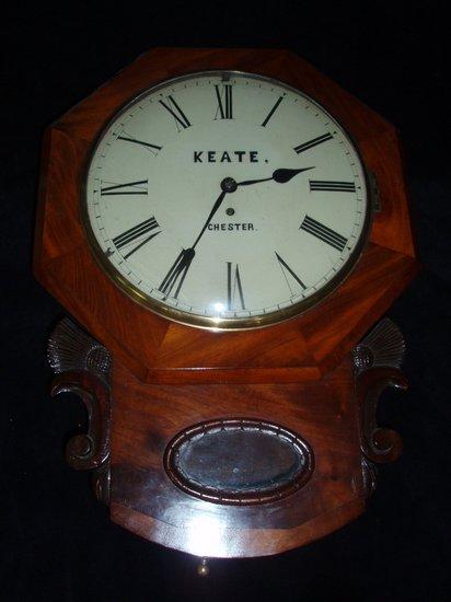 Appraisal: A Regency mahogany drop head wall clock with octagonal surround