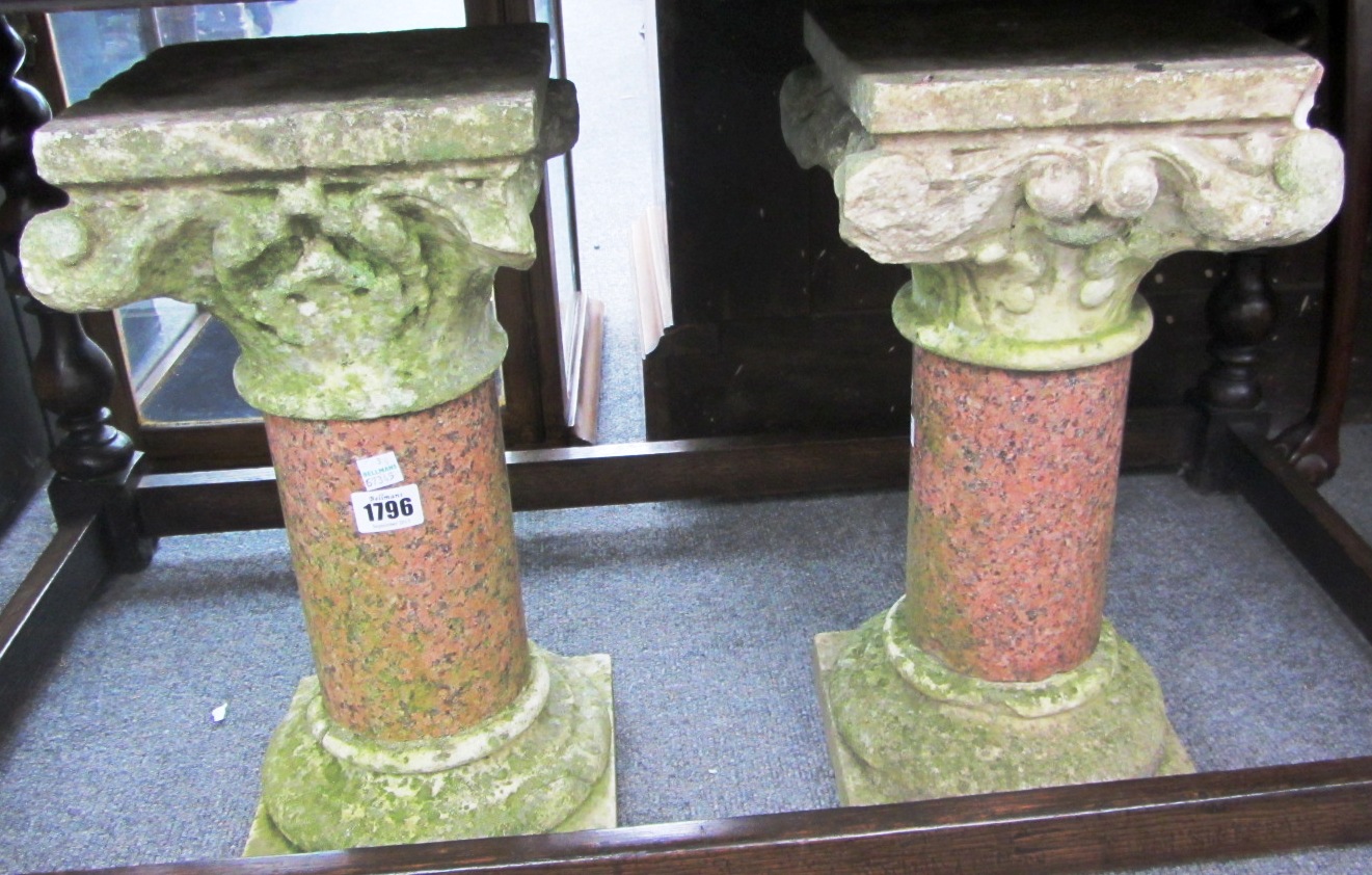 Appraisal: A pair of carved marble columns with scroll capitals and