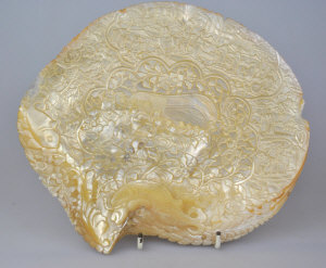 Appraisal: A Chinese mother of pearl shell carved with numerous figures