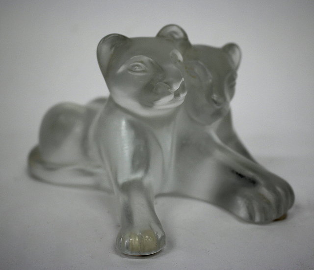 Appraisal: A LALIQUE FRANCE MOULDED GLASS SCULPTURE of two lion cubs