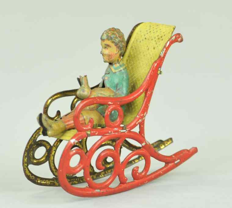 Appraisal: ROCKING CHAIR PENNY TOY Meier pre-war Germany tin ornate red