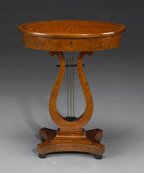 Appraisal: A Biedermeier birchwood sewing table th century height in width