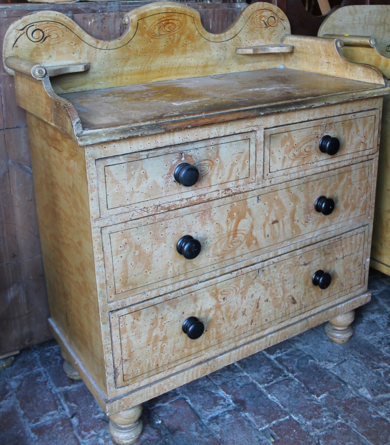 Appraisal: A thC painted pine chest with black highlights and shaped