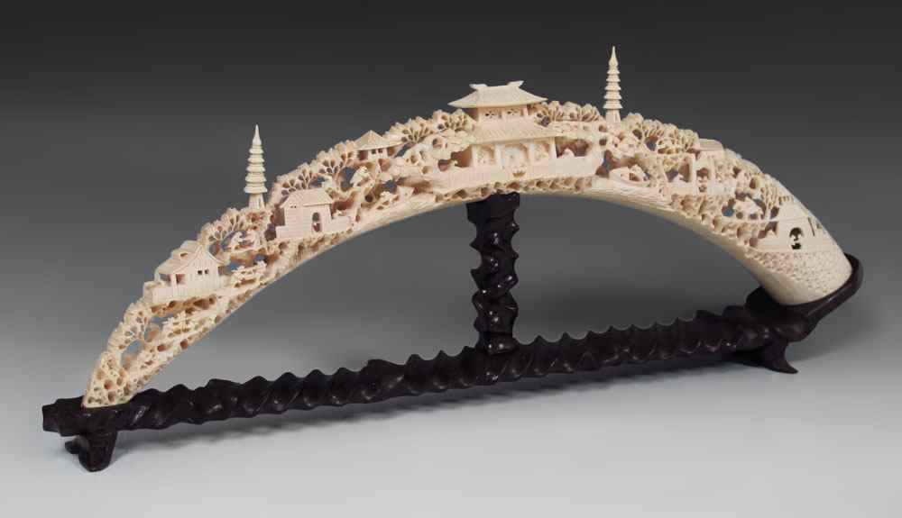 Appraisal: CHINESE CARVED IVORY TUSK Elegantly carved with village genre scene