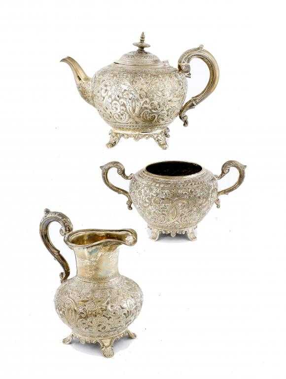 Appraisal: A VICTORIAN TEAPOT MILK JUG AND SUGAR BOWL compressed circular