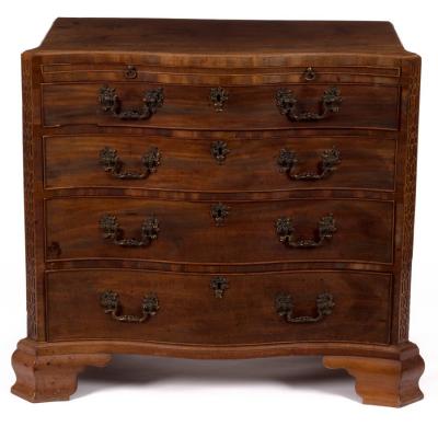 Appraisal: A George III mahogany serpentine chest fitted a brushing slide