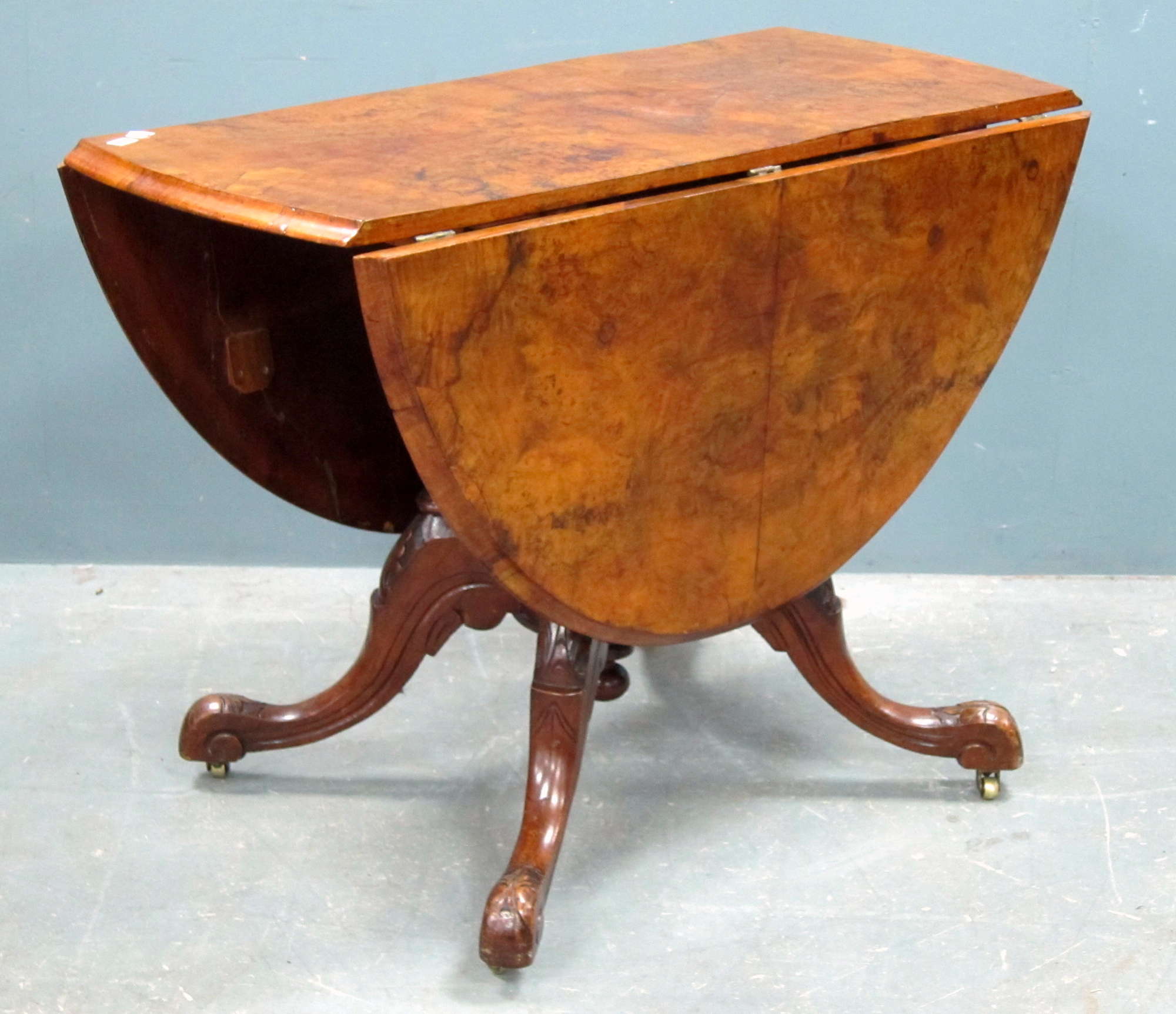 Appraisal: th century burr walnut drop flap dining table on column