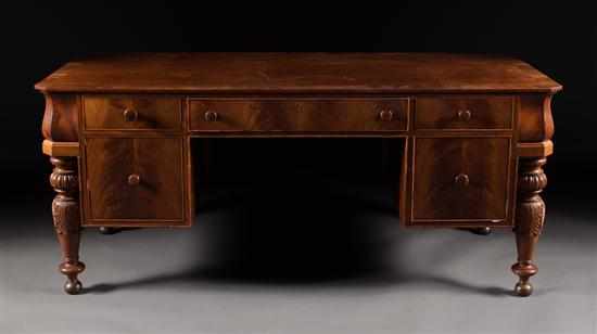 Appraisal: American Classical style carved and banded mahogany kneehole desk first