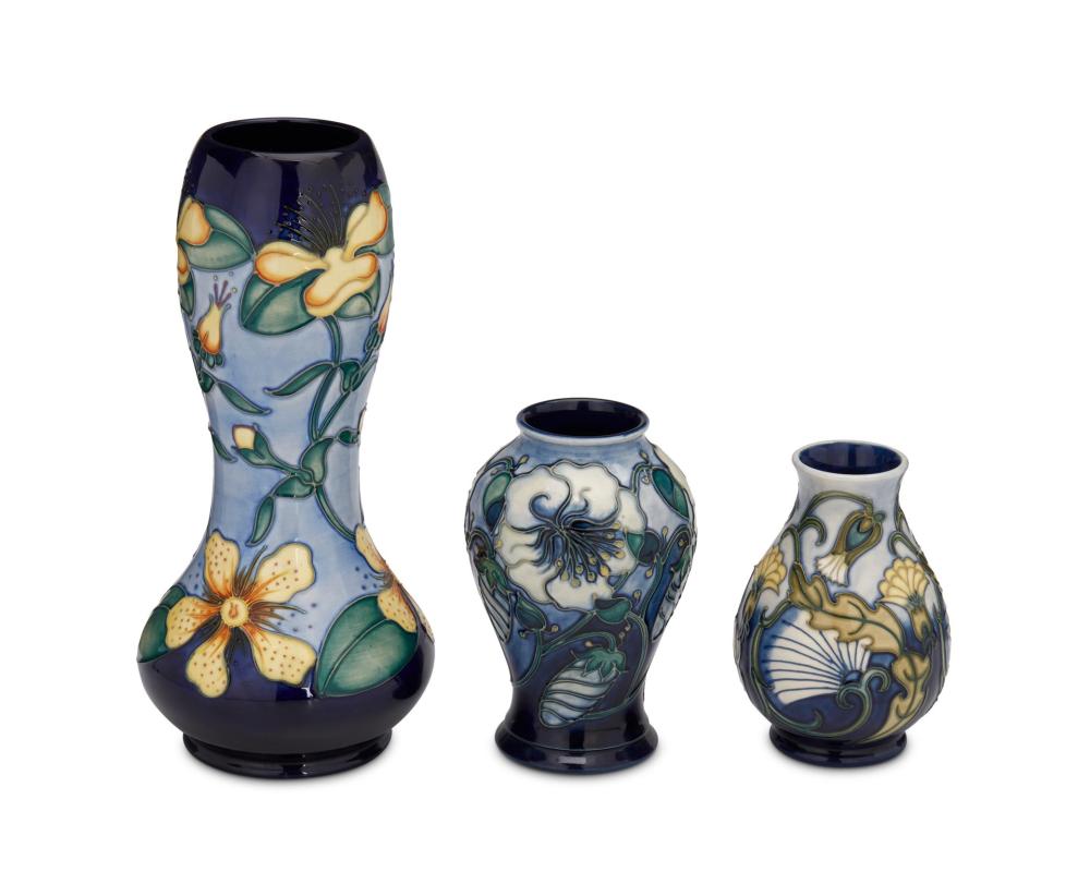 Appraisal: A GROUP OF MOORCROFT POTTERY VASESA group of Moorcroft pottery