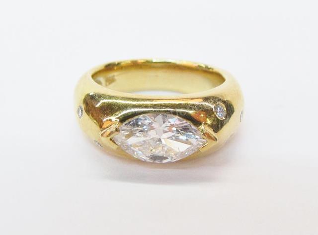 Appraisal: An K yellow gold lady's ring with center marquis diamond