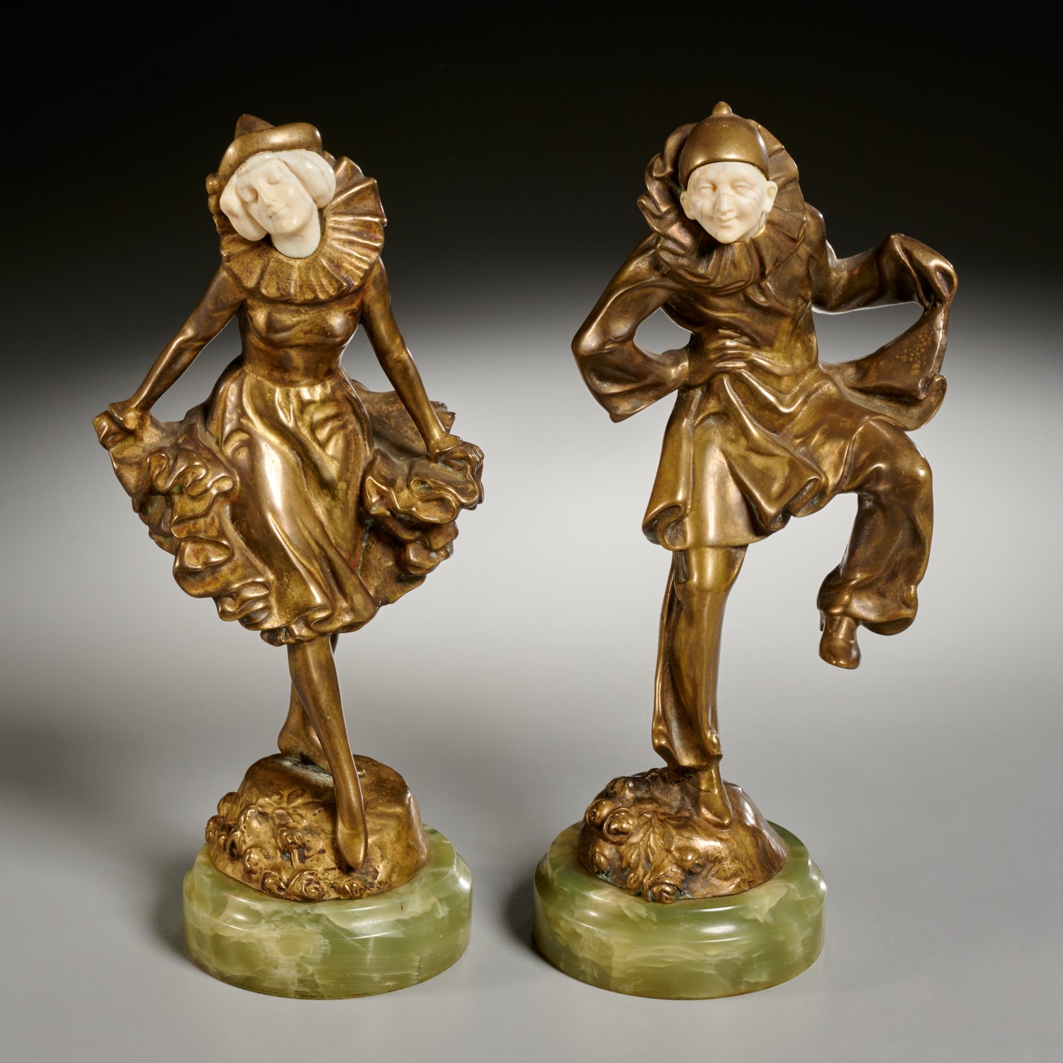 Appraisal: PAIR AUSTRIAN ART DECO GILT BRONZE FIGURES c Pierrot and