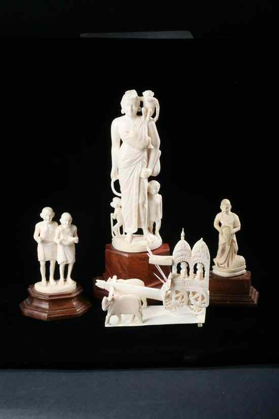 Appraisal: FOUR PIECES INDIAN IVORY Standing female with monkeys and children