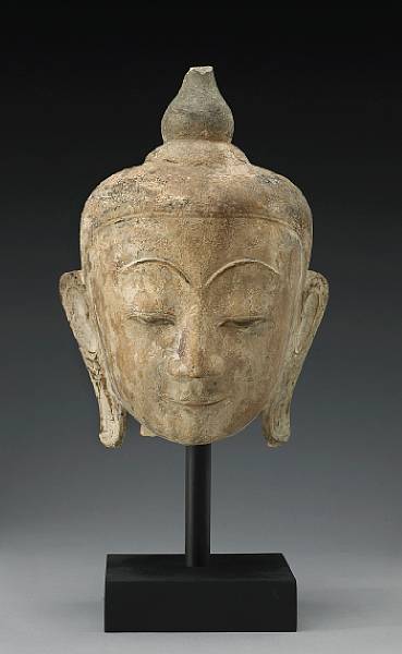 Appraisal: A Burmese painted stone head of the Buddha th Century