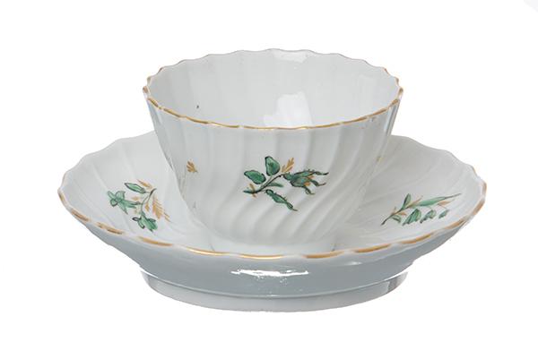 Appraisal: A WORCESTER PORCELAIN TEA BOWL AND SAUCER CIRCA Of fluted