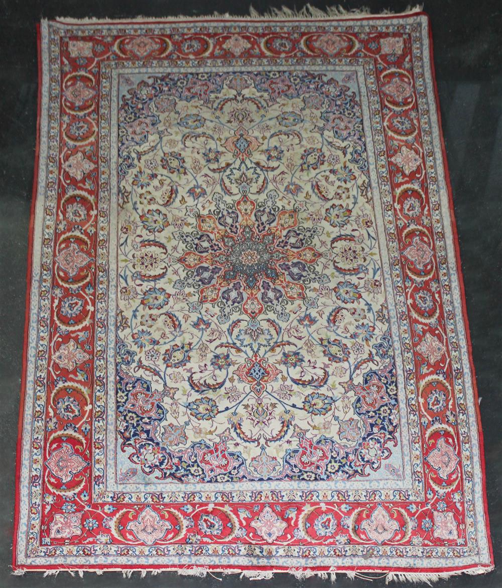 Appraisal: ISFAHAN WOOL RUG central medallion radiating into intertwining leaves and