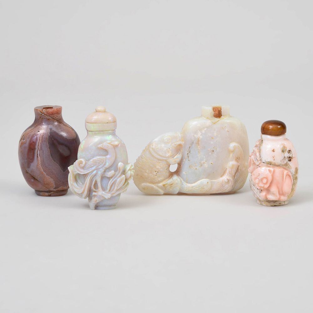 Appraisal: Four Chinese Carved Hardstone Snuff Bottles Comprising An agate example