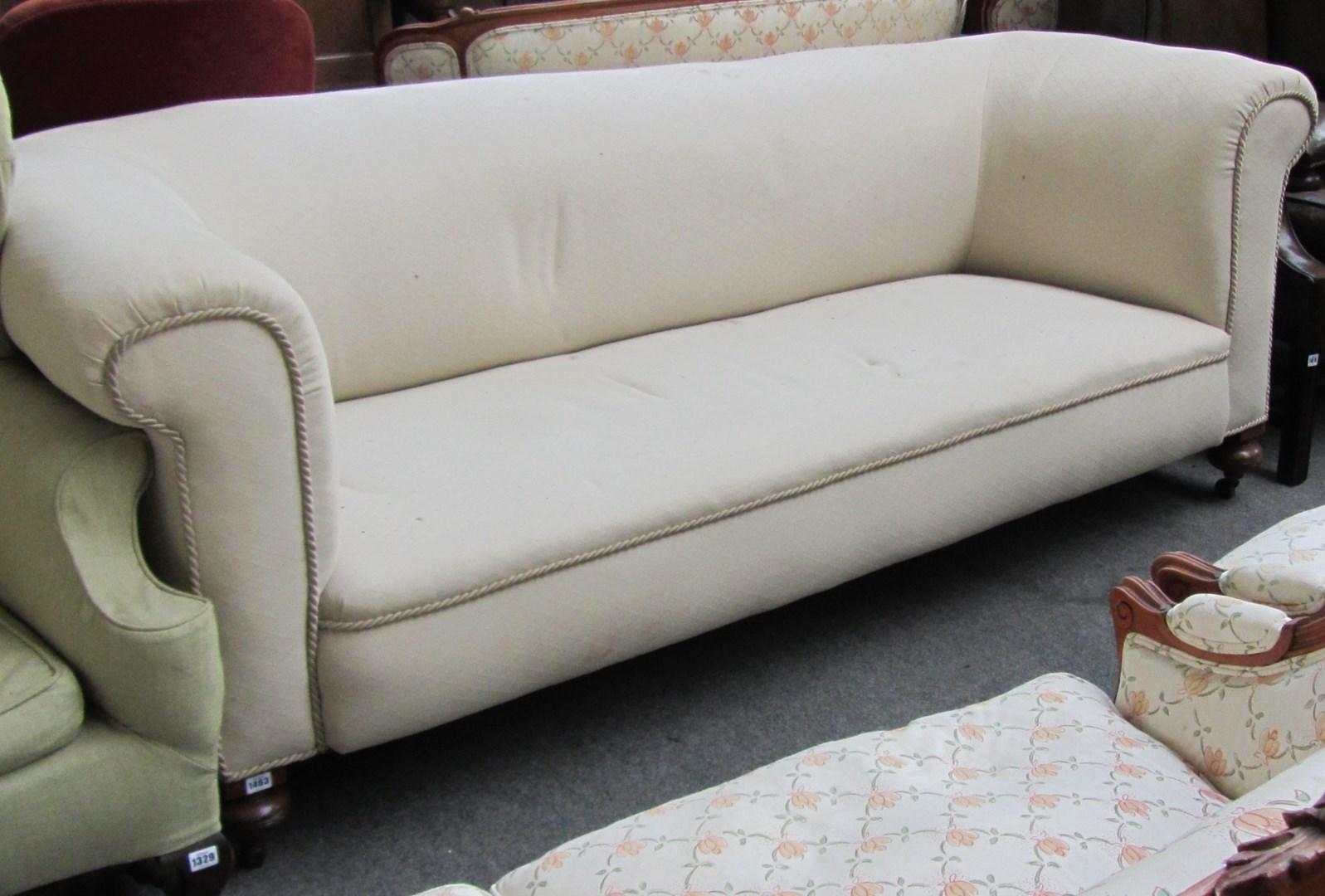 Appraisal: A Victorian Chesterfield sofa on turned mahogany supports cm wide