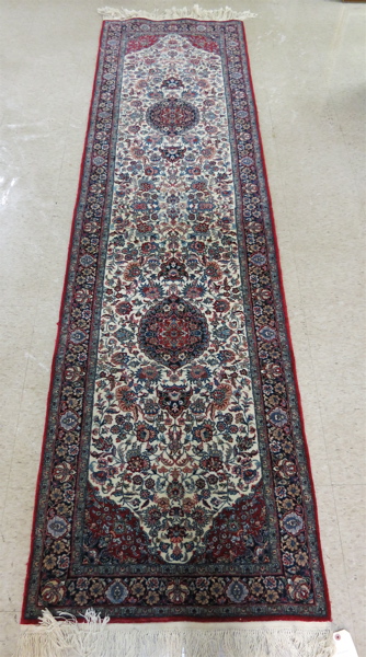 Appraisal: HAND KNOTTED ORIENTAL HALL RUG Sino-Persian overall floral design on