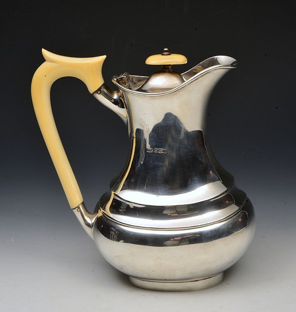 Appraisal: A GEORGE VI SILVER COFFEE POT of oval waisted form