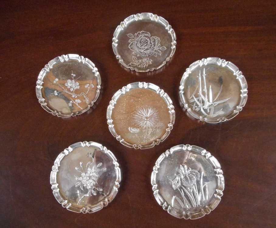 Appraisal: SET OF SIX JAPANESE STERLING SILVER COASTERS engraved with various