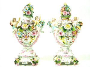 Appraisal: Pair of continental flower encrusted twin-handled vases and covers with