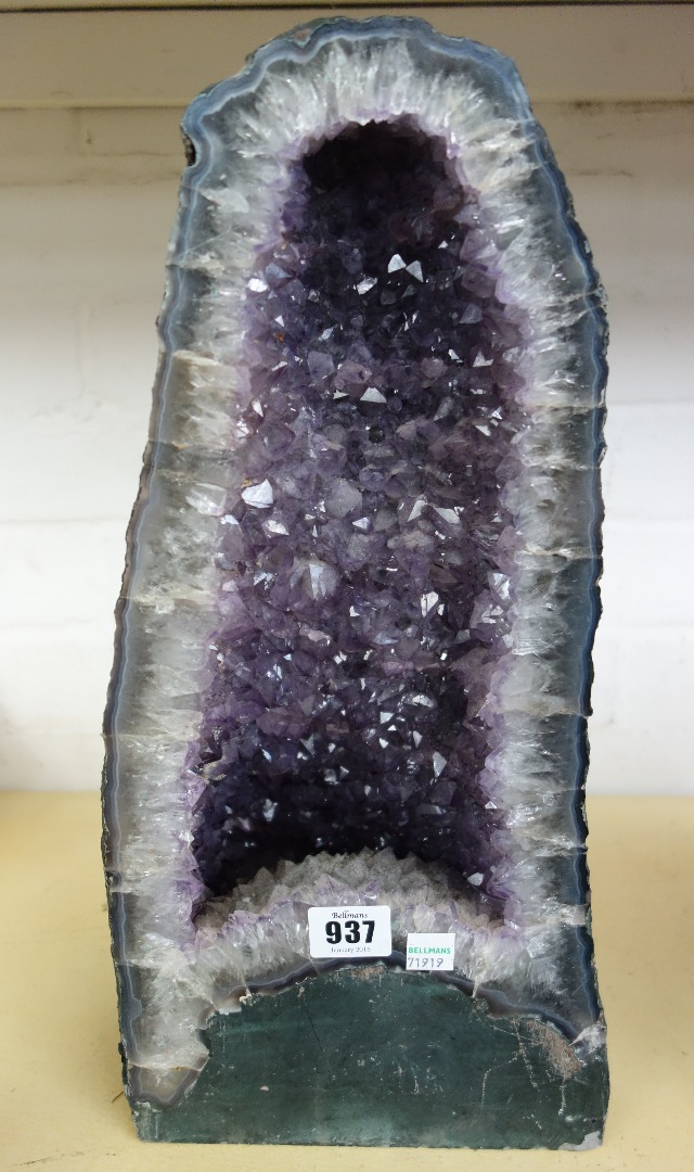 Appraisal: Three amethyst quartz geode specimens of naturalistic form the largest