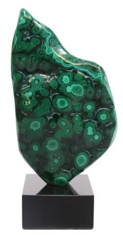 Appraisal: Polished malachite specimen Congo mounted on black marble base specimen