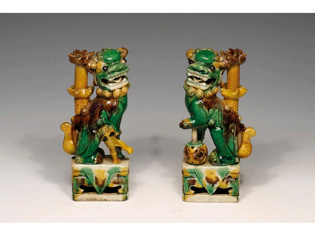 Appraisal: A PAIR OF CHINESE BISCUIT PORCELAIN JOSS STICK HOLDERS splashed