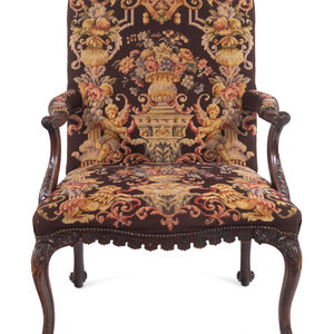 Appraisal: A George II Style Carved Mahogany Armchair with Needlepoint Upholstery