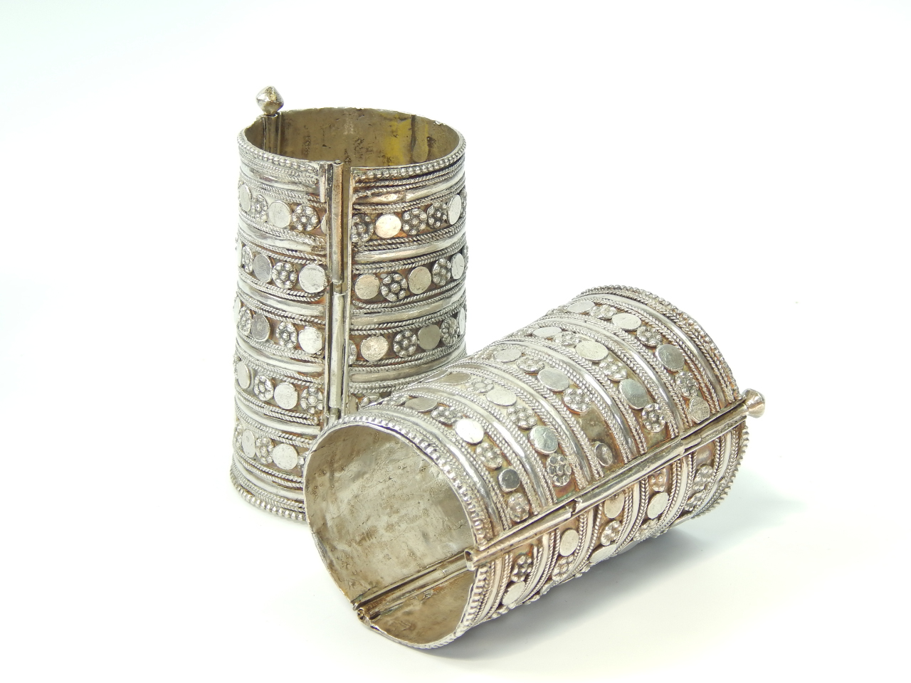 Appraisal: A pair of Somali or Ethiopian white metal cuffs decorated