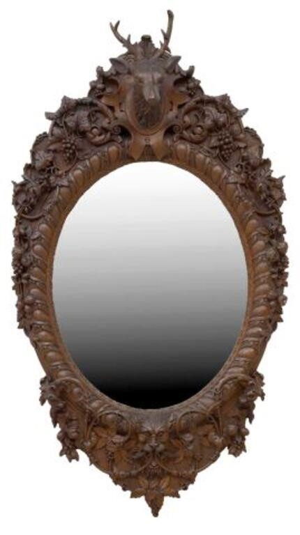 Appraisal: Black Forest style carved oak mirror signed verso L Huisser