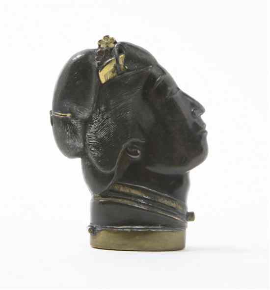 Appraisal: A Japanese Mixed Metal Figural Matchstrike depicting a woman's head