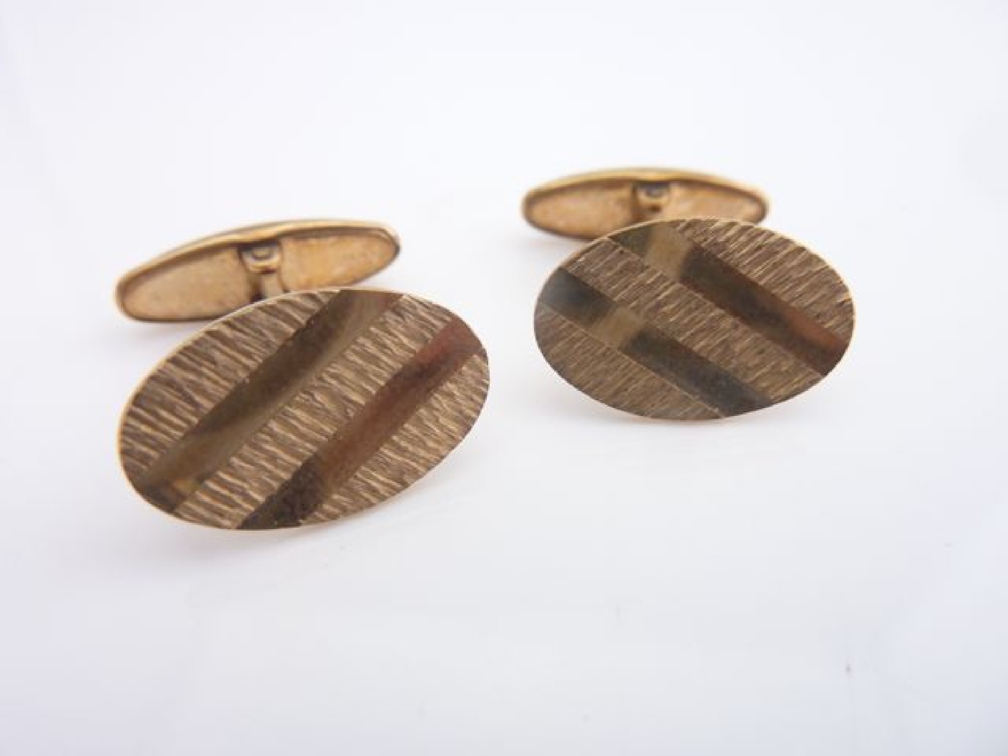 Appraisal: A pair of ct gold cufflinks each with polished and