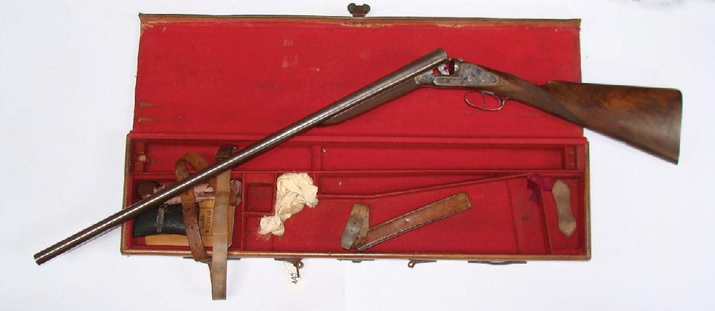 Appraisal: A DOUBLE BARRELLED SHOTGUN engraved between the barrels Robert Hughes