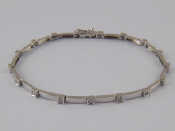 Appraisal: A white metal tests carat gold diamond bracelet approx cm