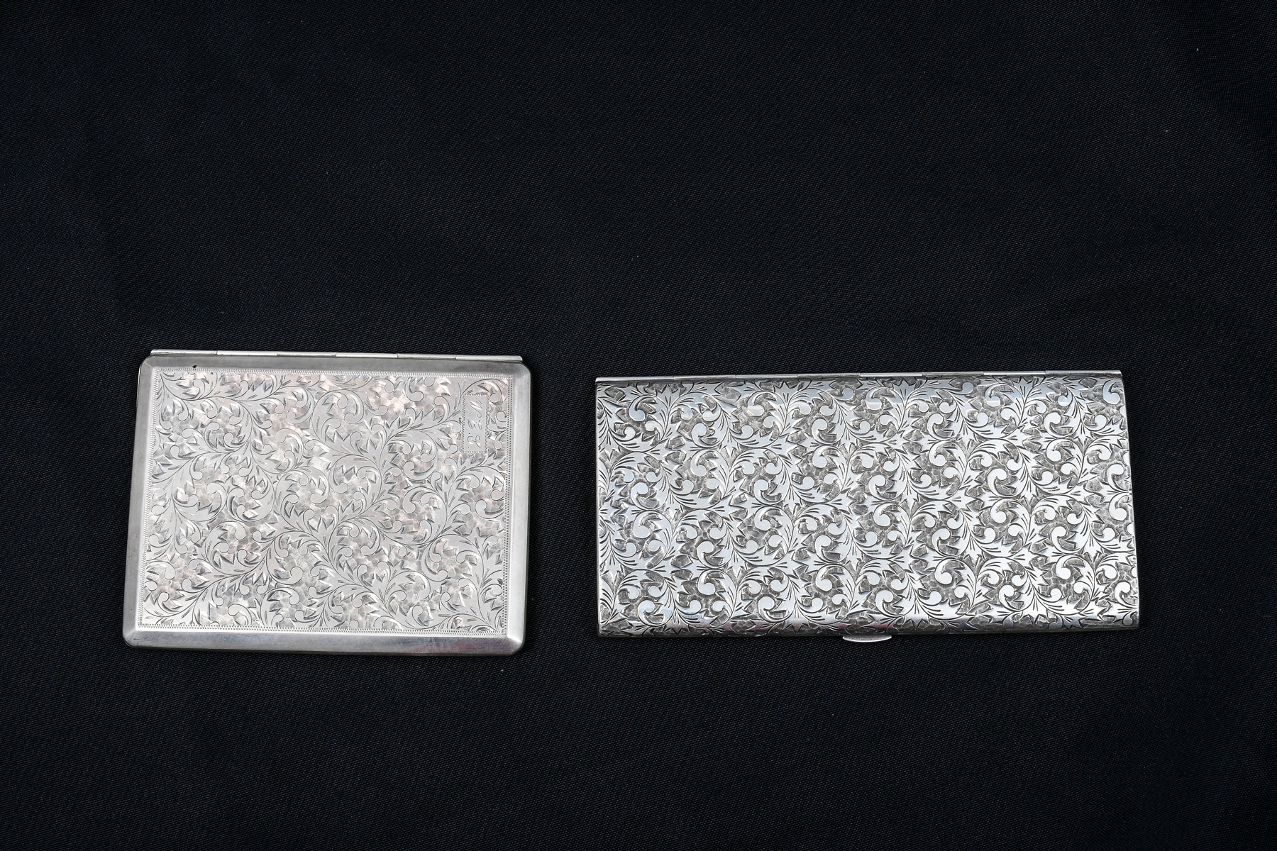 Appraisal: ENGRAVED SILVER CIGARETTE CASES Comprising cases of Silver having intricate