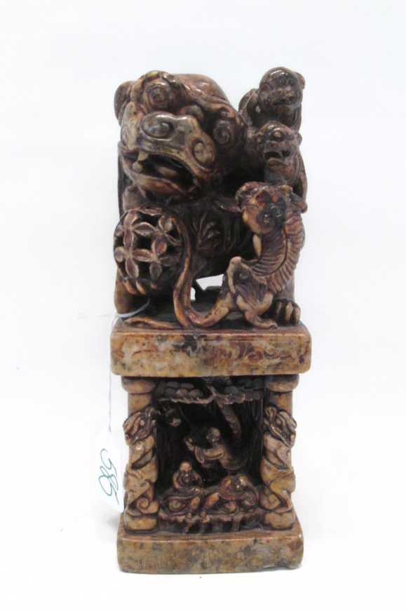 Appraisal: CHINESE CARVED SOAPSTONE SEAL depicting a foo-dog and three pups