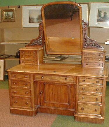 Appraisal: A Victorian mahogany kneehole dressing table with mirrored and drawer