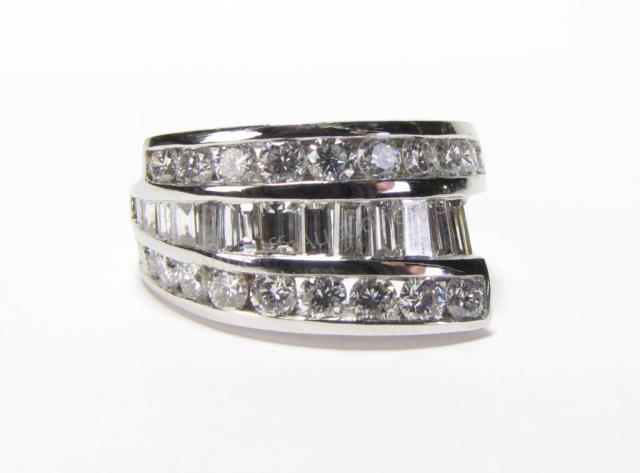 Appraisal: A K white gold fashion ring with fourteen channel set