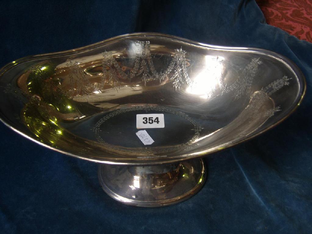 Appraisal: An open silver dish of shaped form on pedestal with