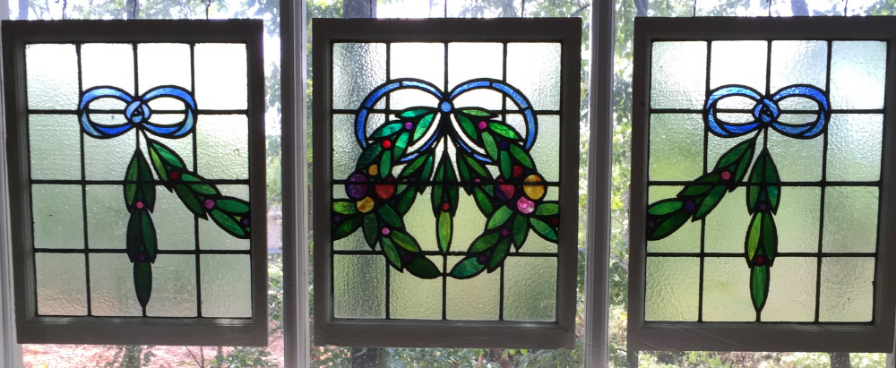 Appraisal: ENGLISH TRIPTYCH OF LEADED GLASS WINDOWS Center window with wreath