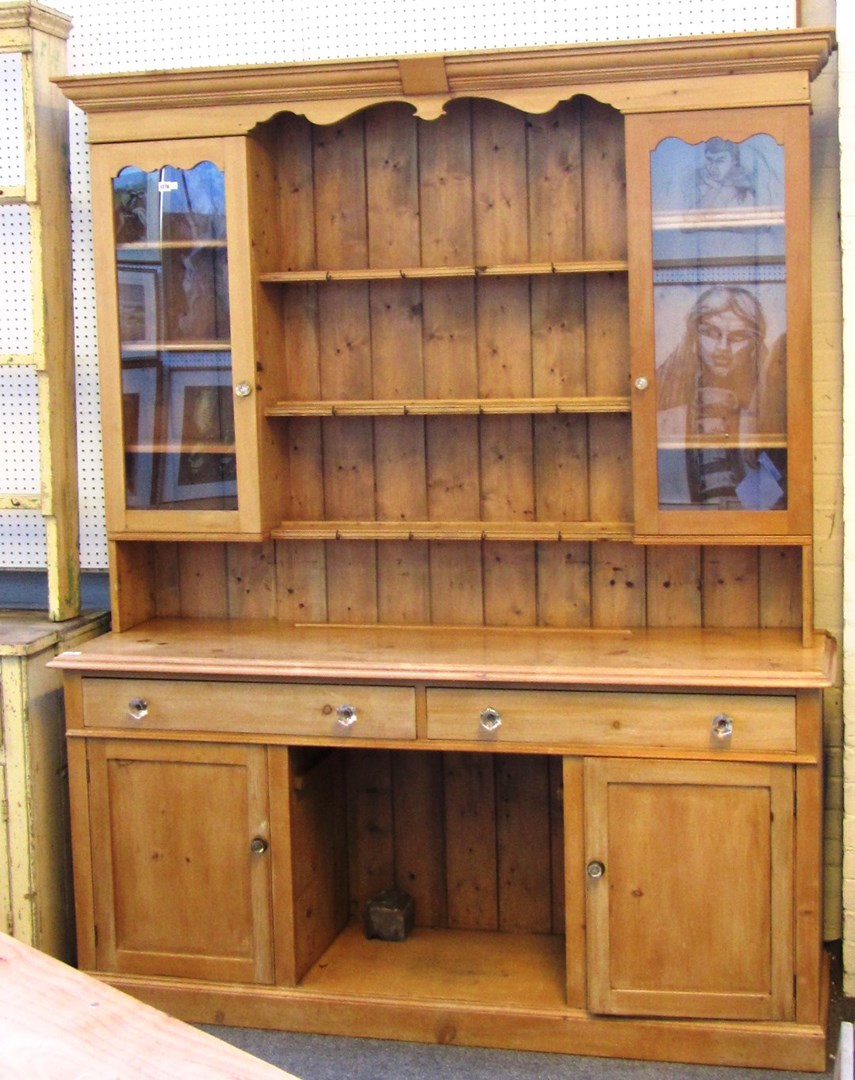 Appraisal: A made-up th century pine dresser with cupboard three tier