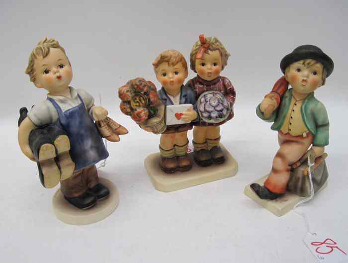 Appraisal: THREE GERMAN HUMMEL PORCELAIN FIGURINES ''Merry Wander'' HUM TM- -