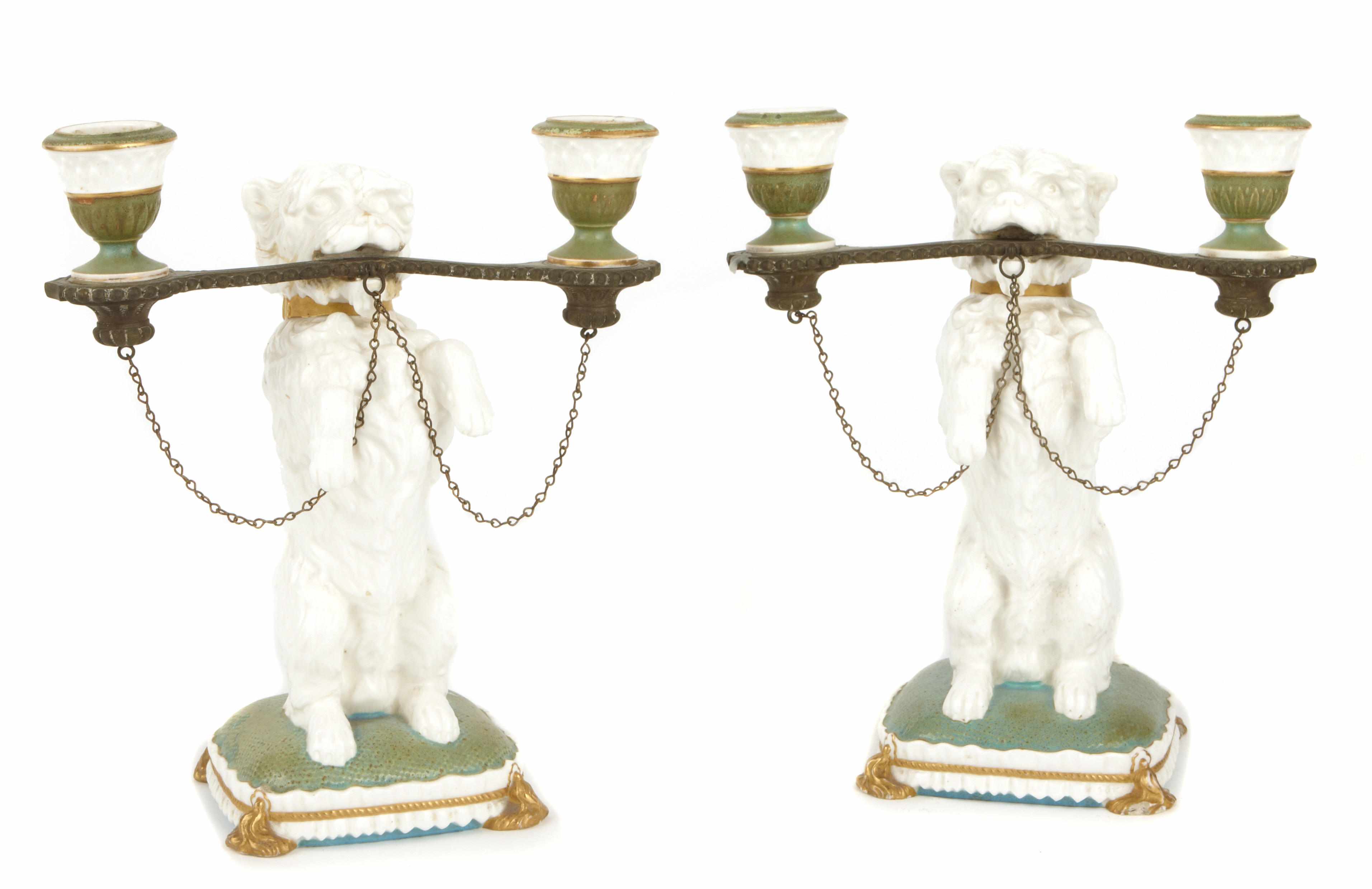 Appraisal: A pair of Brownfield porcelain two light figural candelabra Modeled