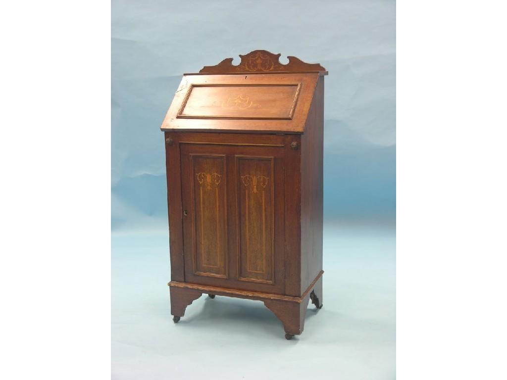 Appraisal: A small Edwardian inlaid mahogany bureau shaped cresting above panelled